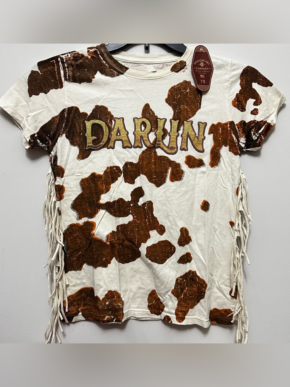 American Darlin Star S/S Fringe Tee with Brown Cowprint and Retro Lettering